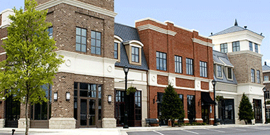 Commercial power wash services including power washing buildings and storefronts.